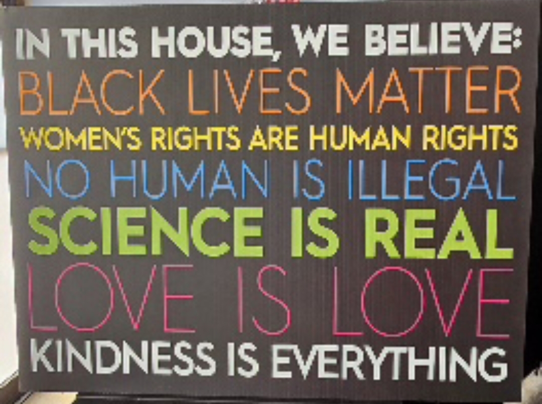 In this house we believe... sign